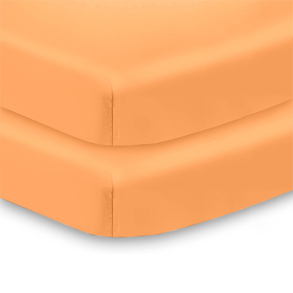 Corner View of BreathableBaby All-in-One Fitted Sheet & Waterproof Cover for Mini Crib Mattresses in Coral