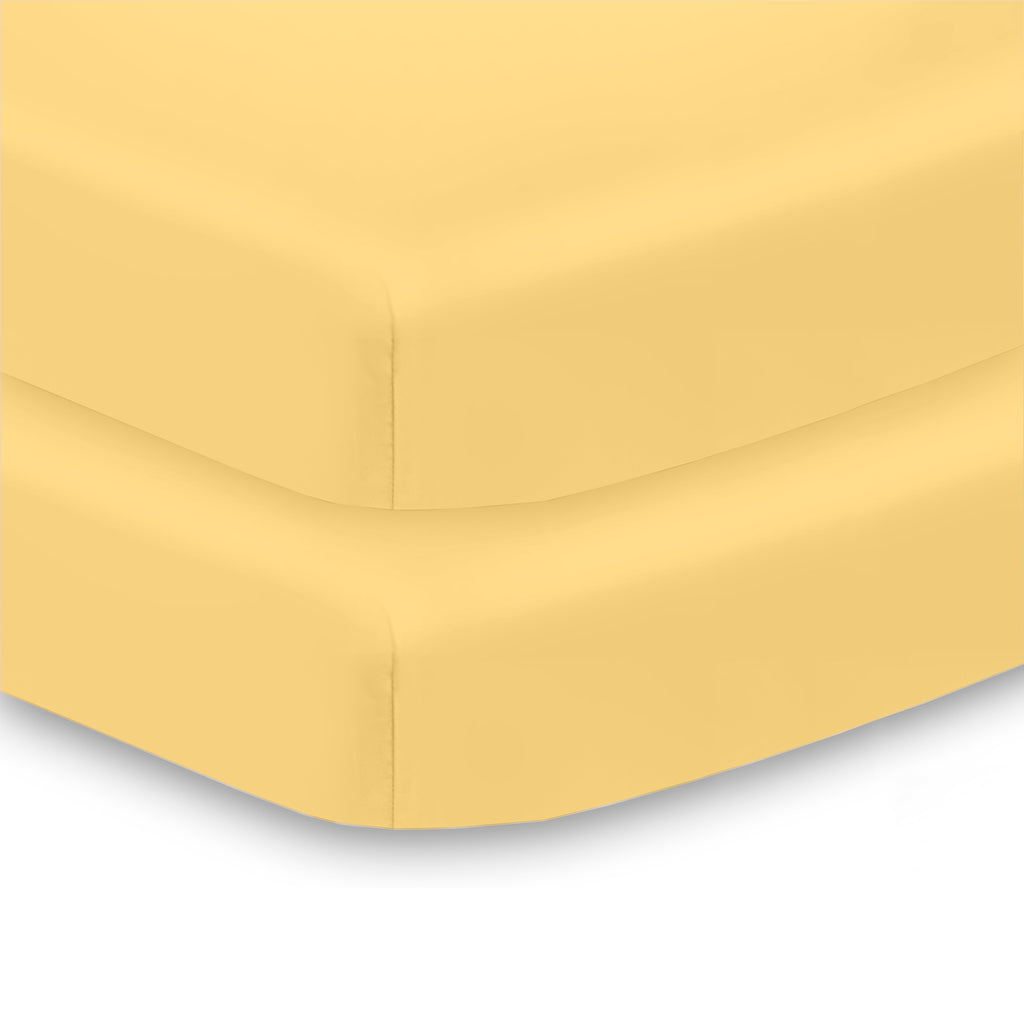 Corner View of BreathableBaby All-in-One Fitted Sheet & Waterproof Cover for Mini Crib Mattresses in Yellow