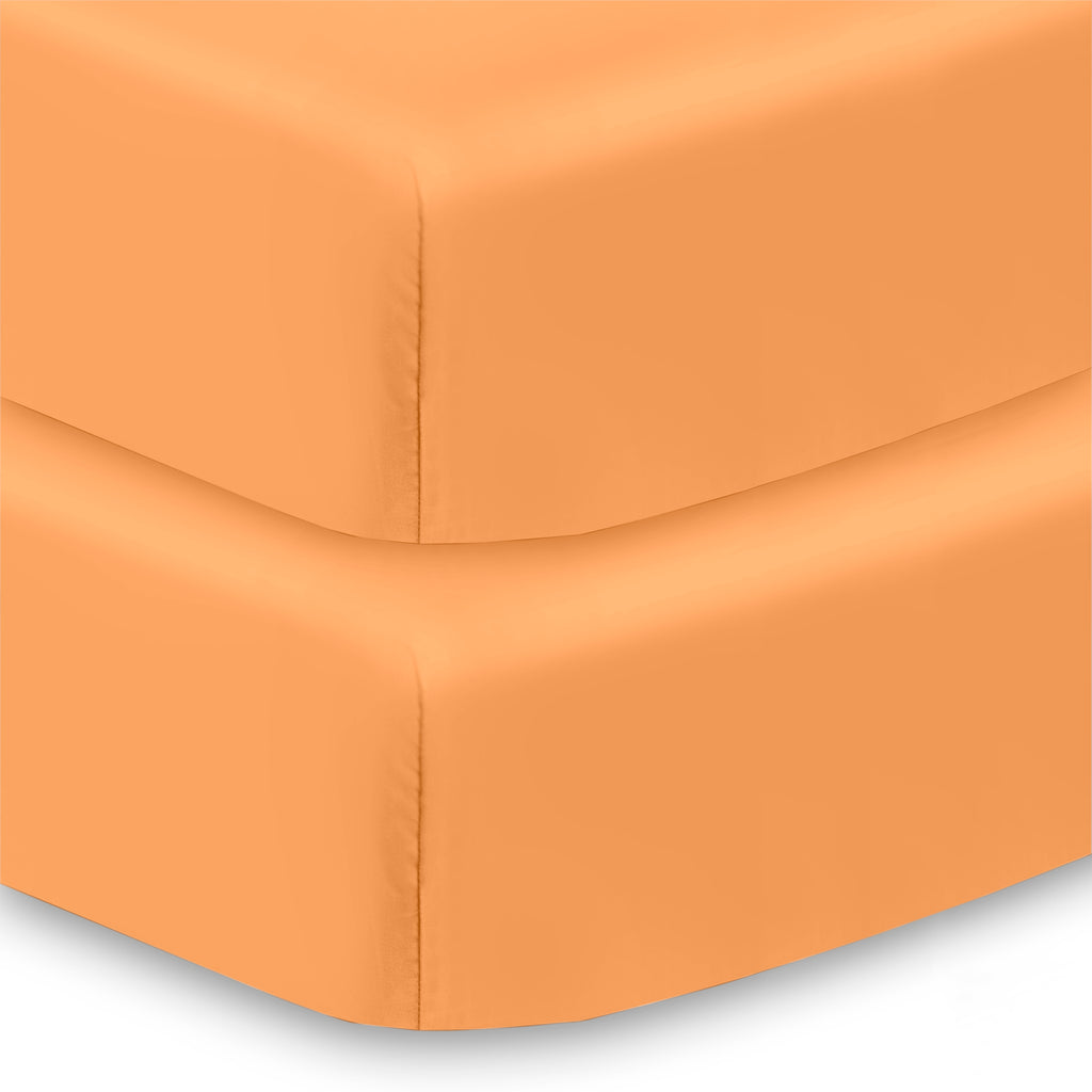 Corner View of BreathableBaby All-in-One Fitted Sheet & Waterproof Cover for Crib Mattresses in Coral