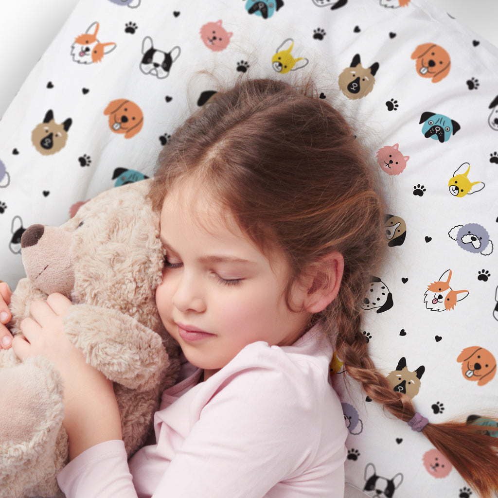 Child using BreathableBaby Cotton Percale Pillowcase for Toddler Pillow in Dogs
