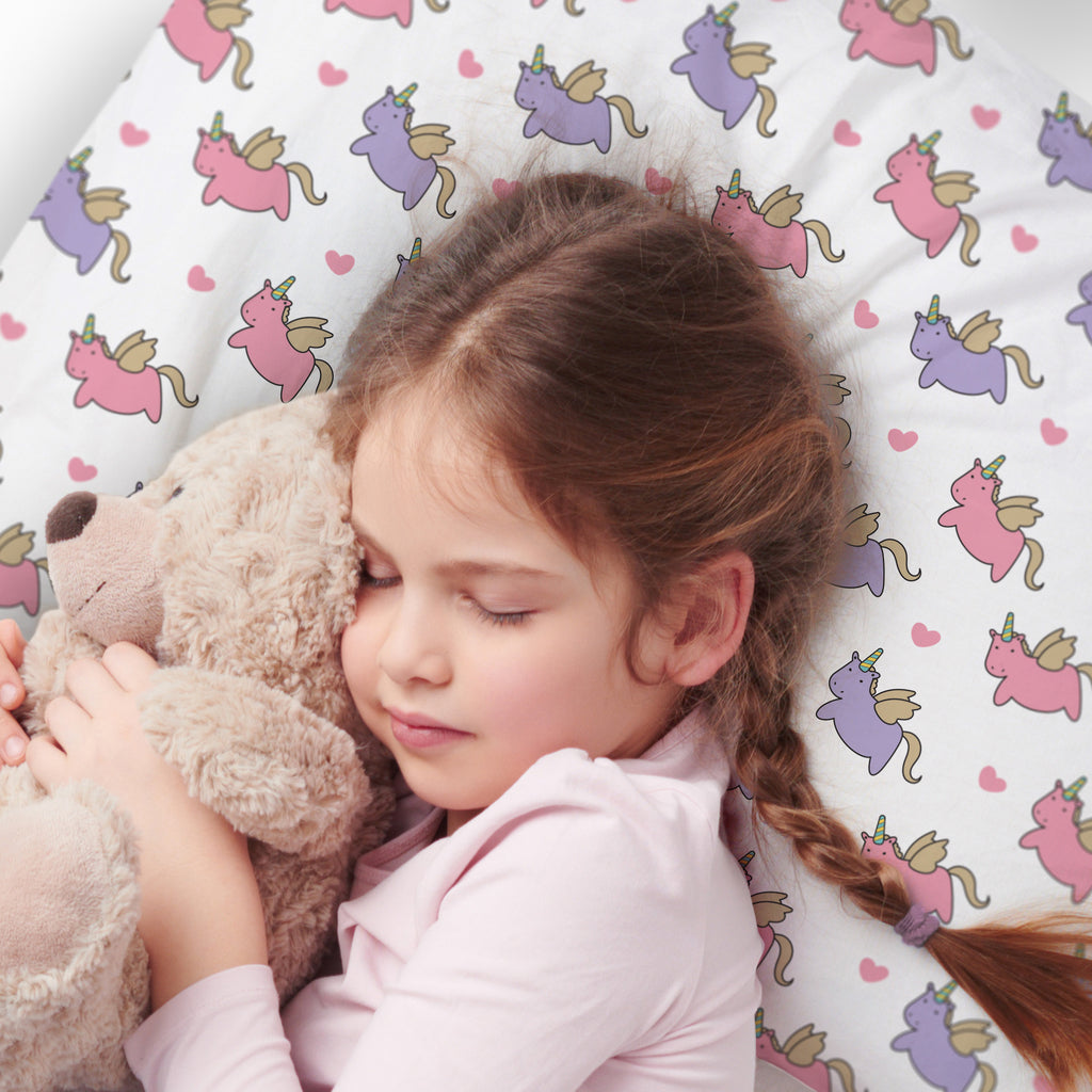 Child using BreathableBaby Cotton Percale Pillowcase for Toddler Pillow in Unicorns