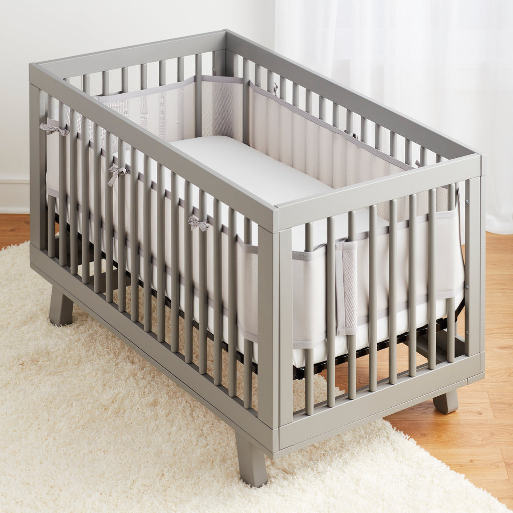Full crib view of BreathableBaby Breathable Mesh Crib Liner on a crib in Gray