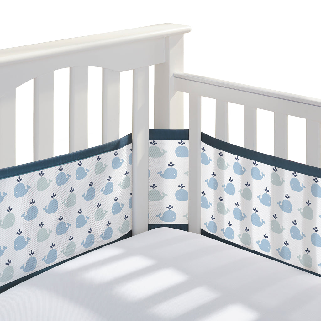 Corner view of BreathableBaby Breathable Mesh Crib Liner on a crib in Little Whale Navy