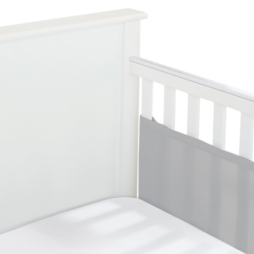  Corner view of BreathableBaby Breathable Mesh Crib Liner on a solid end crib in Gray