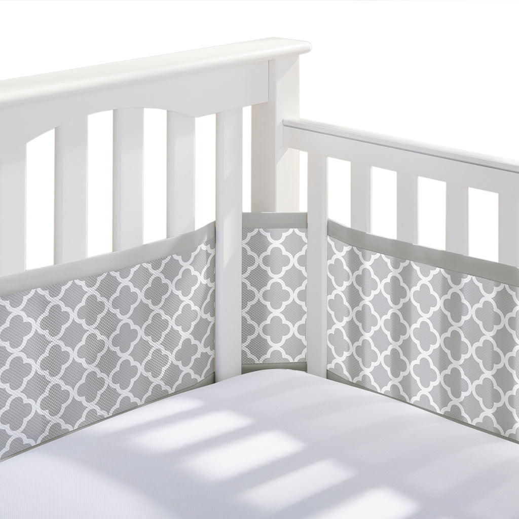 Corner view of BreathableBaby Breathable Mesh Crib Liner on a crib in Gray Clover