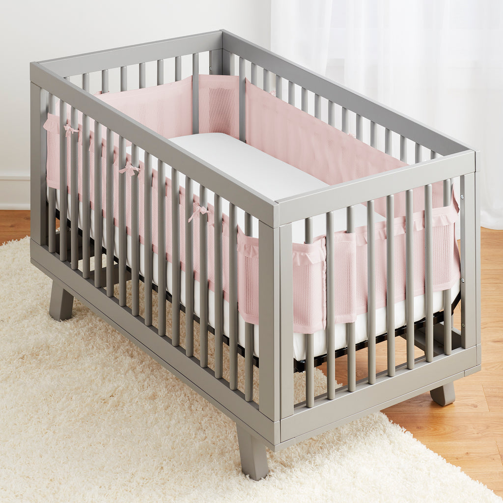 Full crib view of BreathableBaby Breathable Mesh Crib Liner – Deluxe Ruffle Collection on a crib in Blush