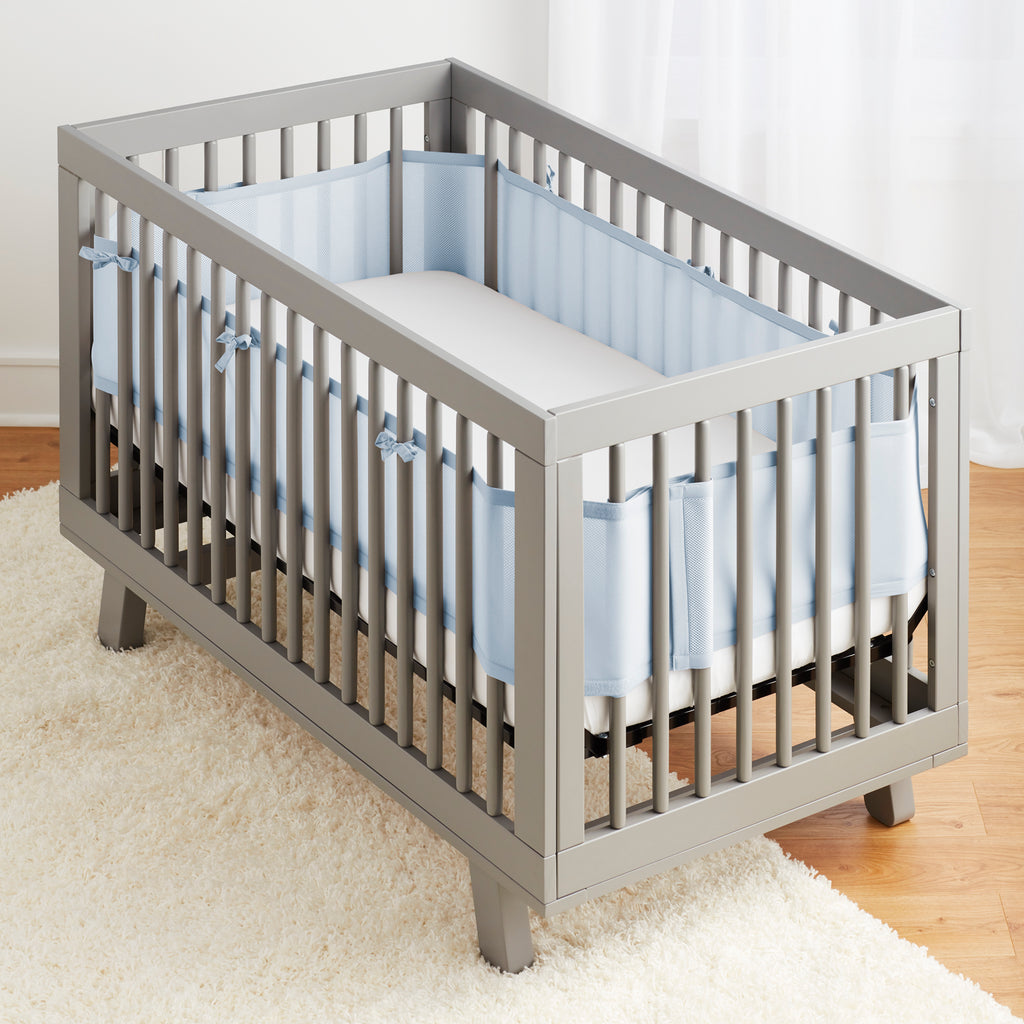 Full crib view of BreathableBaby Breathable Mesh Crib Liner on a crib in Light Blue