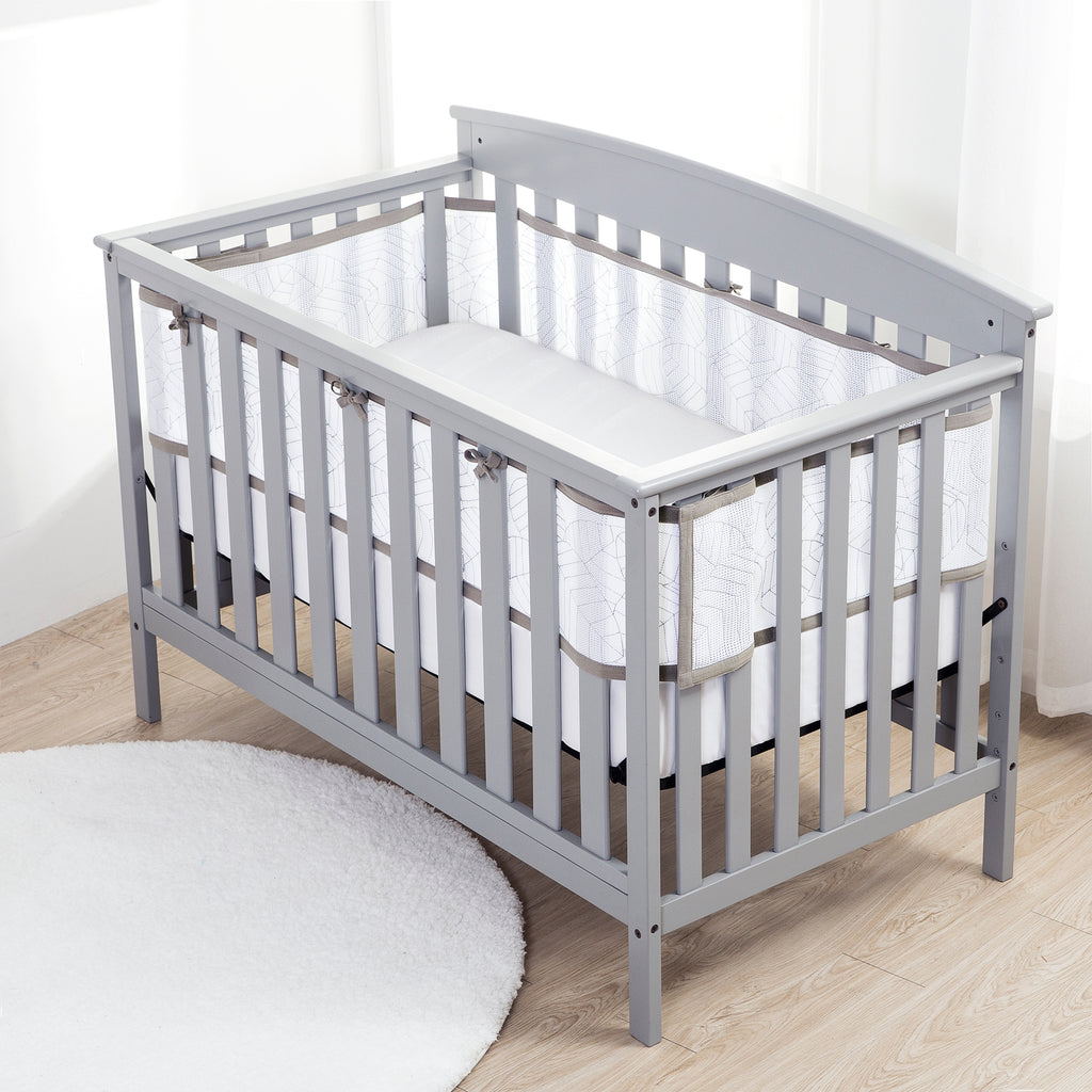 Full crib view of BreathableBaby Breathable Mesh Crib Liner – Deluxe Embroidered Collection on a crib in Woodland Leaves