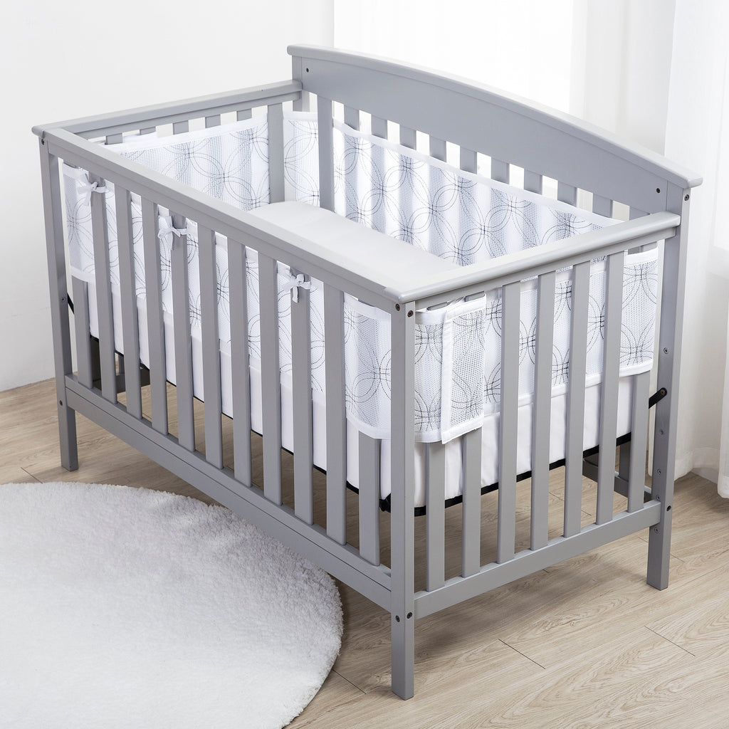 Full crib view of BreathableBaby Breathable Mesh Crib Liner – Deluxe Embroidered Collection on a crib in White Links
