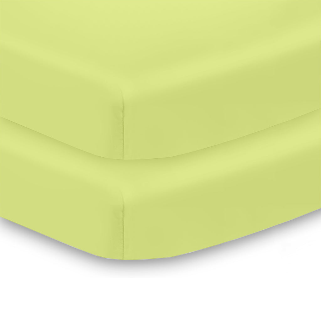 Corner View of BreathableBaby All-in-One Fitted Sheet & Waterproof Cover for Mini Crib Mattresses in Lime