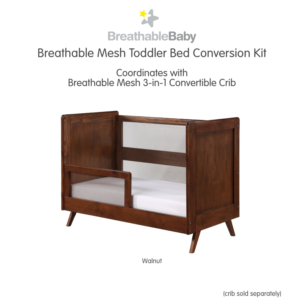 BreathableBaby Breathable Mesh Toddler Bed Conversion Kit in Walnut shown on converted toddler bed shown on white background