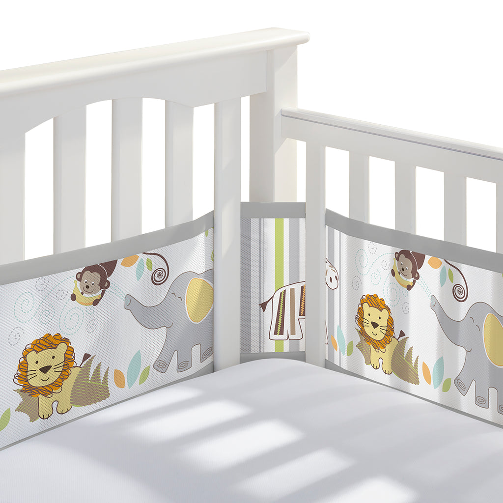 Corner view of BreathableBaby Breathable Mesh Crib Liner on a crib in Safari Fun Too