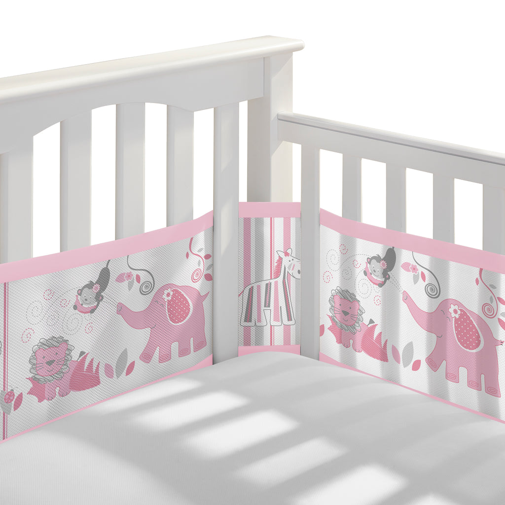 Corner view of BreathableBaby Breathable Mesh Crib Liner on a crib in Safari Fun Girl