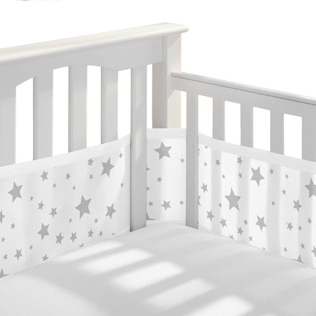 Corner view of BreathableBaby Breathable Mesh Crib Liner on a crib in Starlight