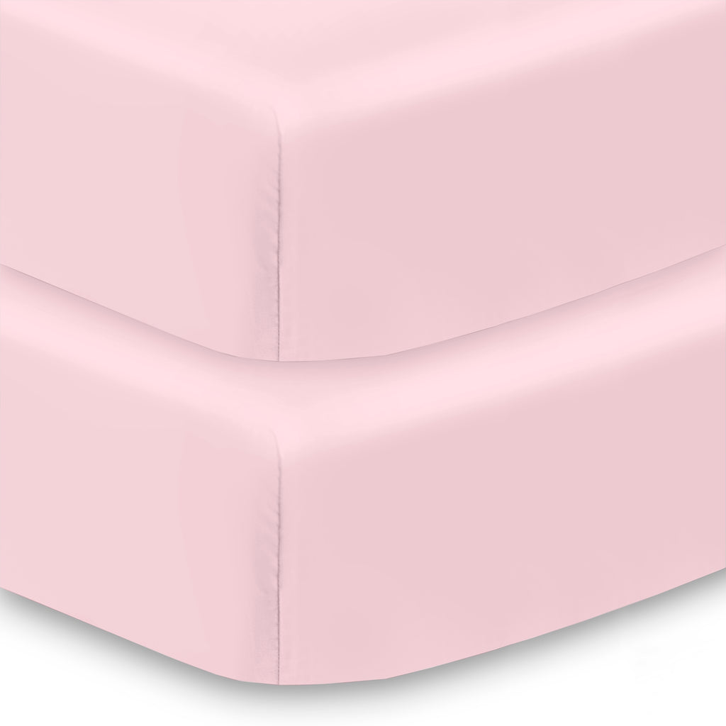 Corner View of BreathableBaby All-in-One Fitted Sheet & Waterproof Cover for Crib Mattresses in Pink