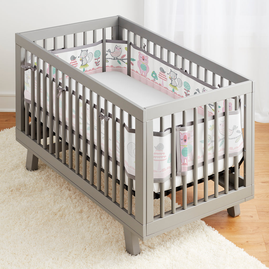 Full crib view of BreathableBaby Breathable Mesh Crib Liner on a crib in Forest Fun Pink print