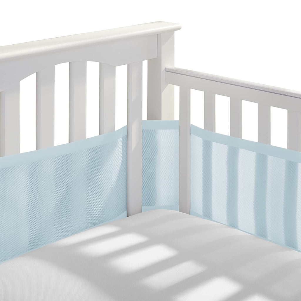 Corner view of BreathableBaby Breathable Mesh Crib Liner on a crib in Light Blue