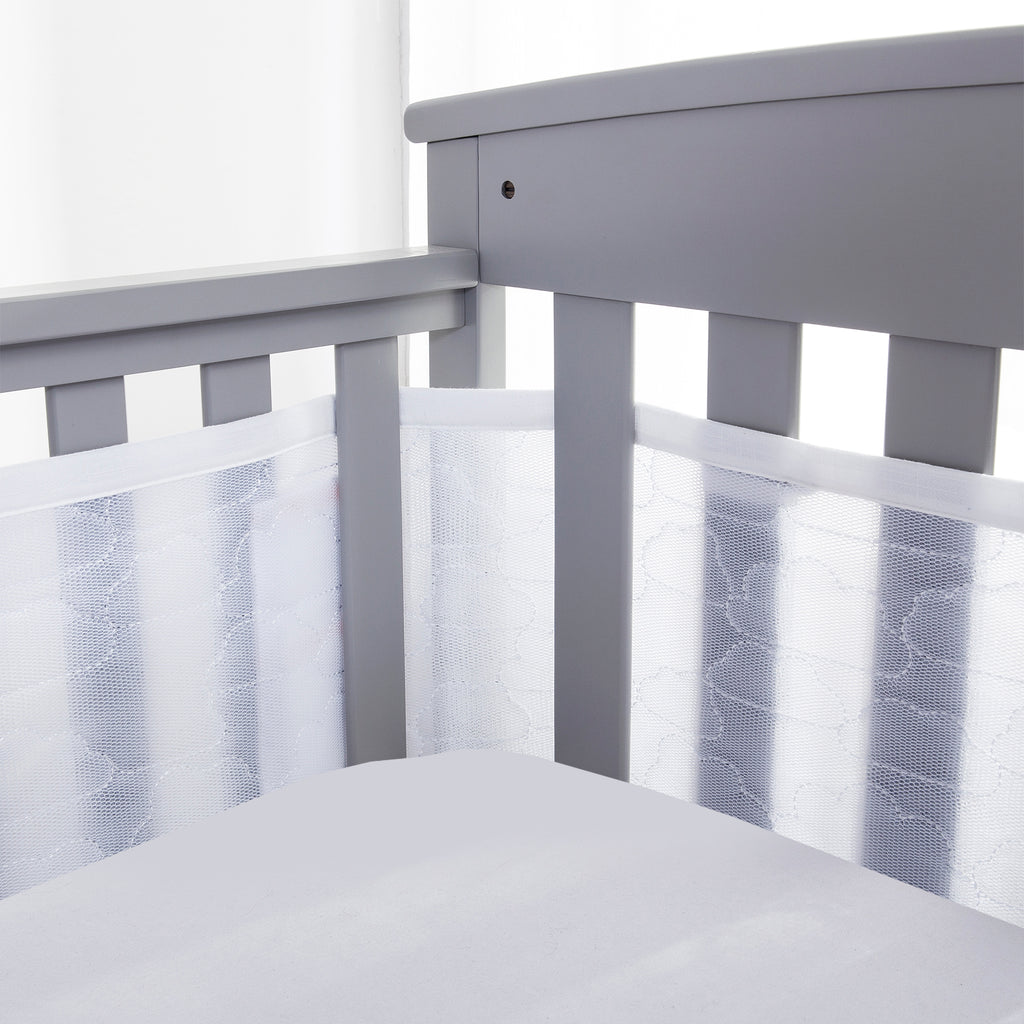 Corner view of BreathableBaby Breathable Mesh Crib Liner – Deluxe Sheer Quilted Collection on a crib in Clouds 