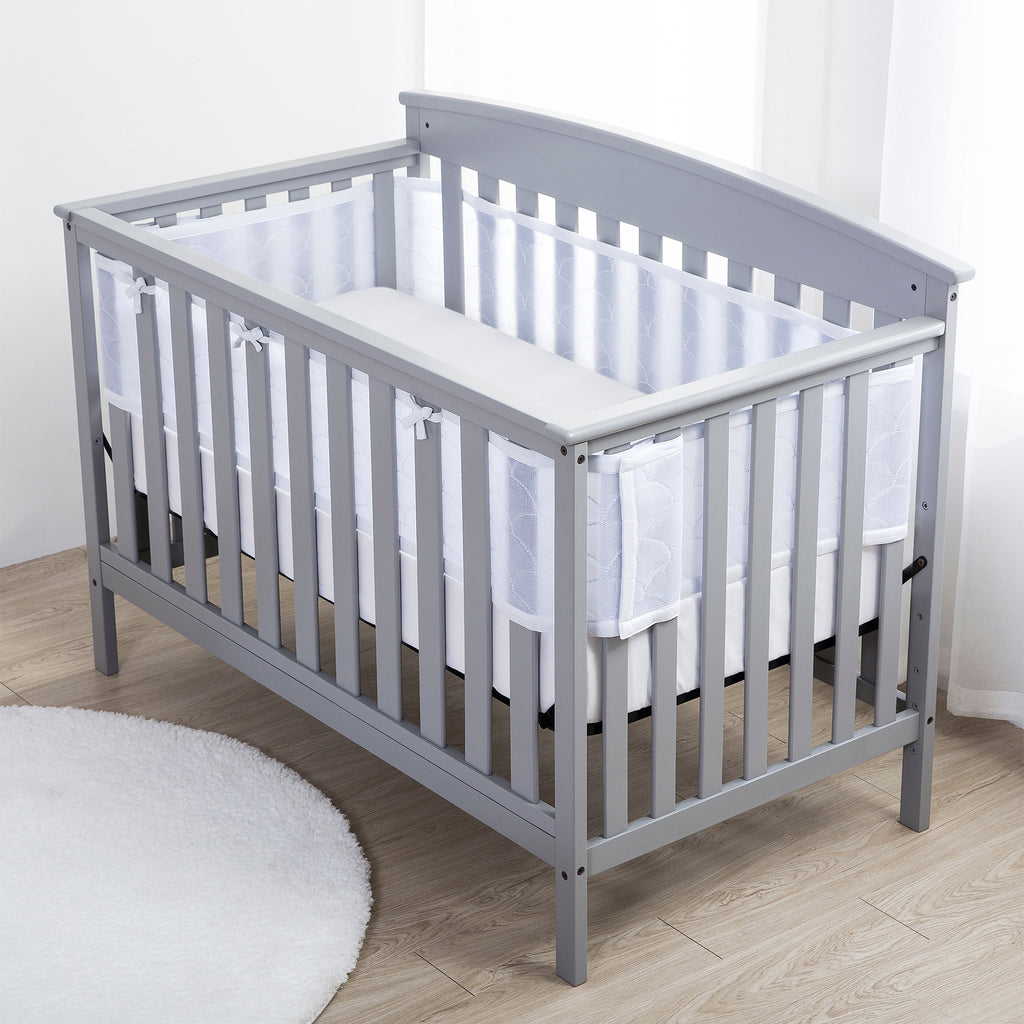 Full crib view of BreathableBaby Breathable Mesh Crib Liner – Deluxe Sheer Quilted Collection on a crib in Scallop