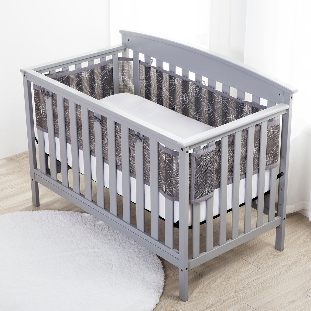Full crib view of BreathableBaby Breathable Mesh Crib Liner – Deluxe Embroidered Collection on a crib in Gray Links