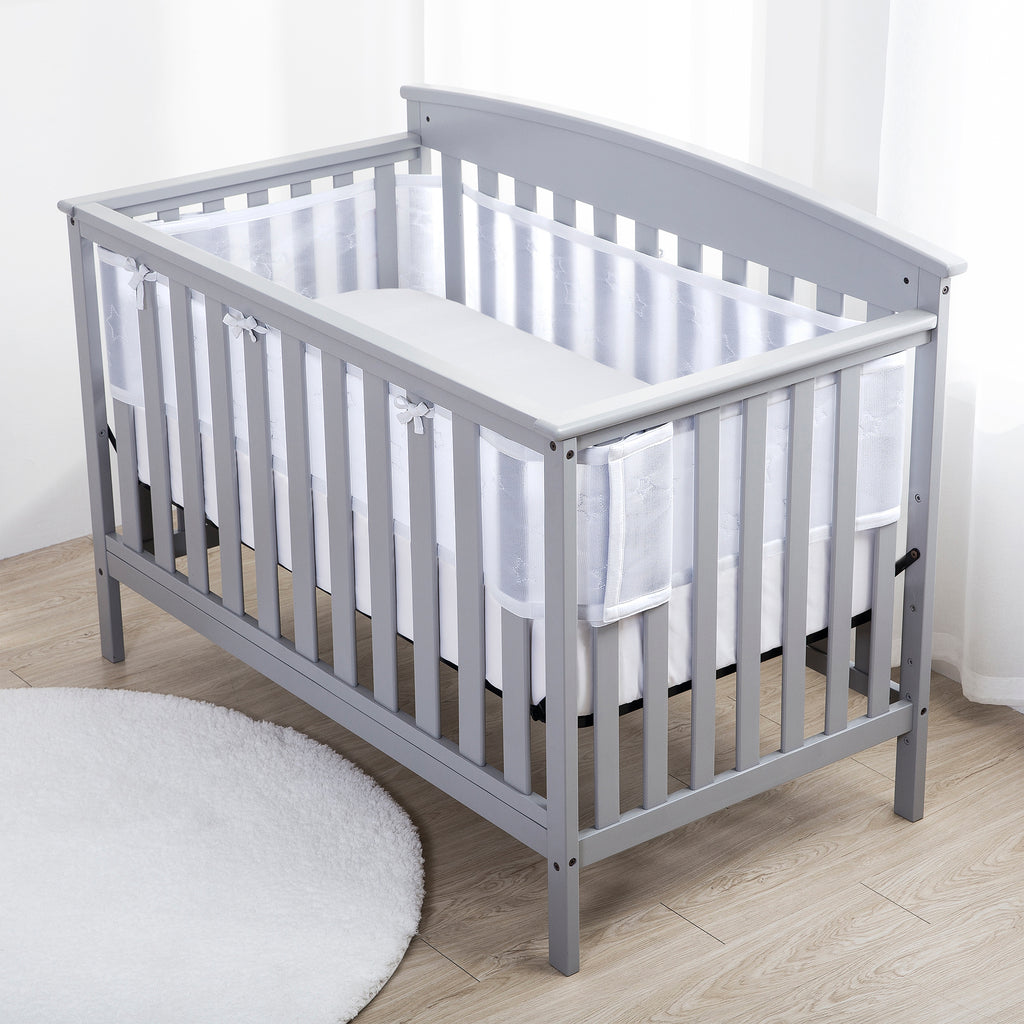 Full crib view of BreathableBaby Breathable Mesh Crib Liner – Deluxe Sheer Quilted Collection on a crib in Stars